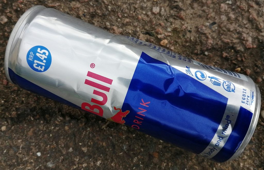 Red Bull can lying in the road.