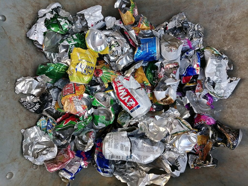 Picture of drinks can shredded by a mower.
